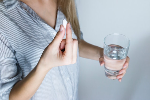 woman taking supplements